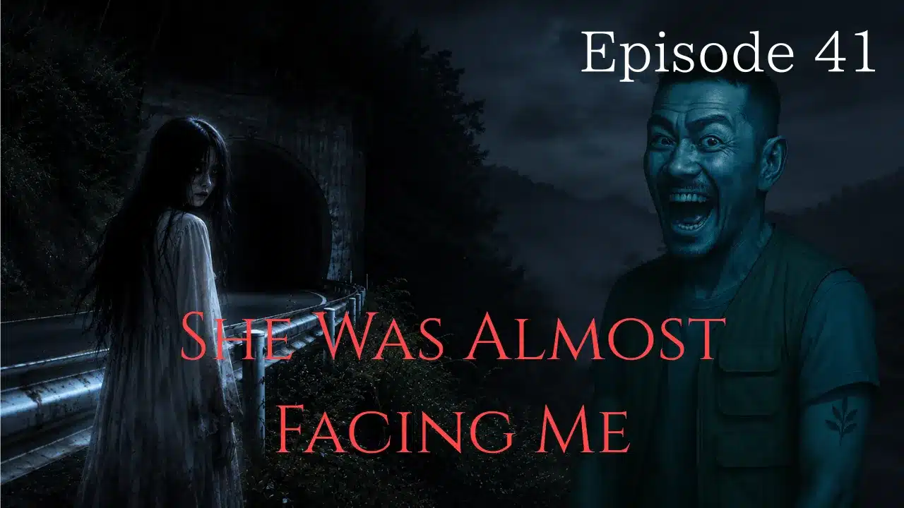 A ghostly woman standing near a dark mountain tunnel slowly turns toward the viewer while a terrified man stares in fear.
